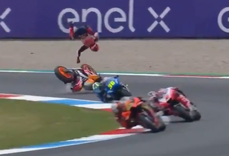 MotoGP racer somehow limps away after being flung from bike in dramatic crash