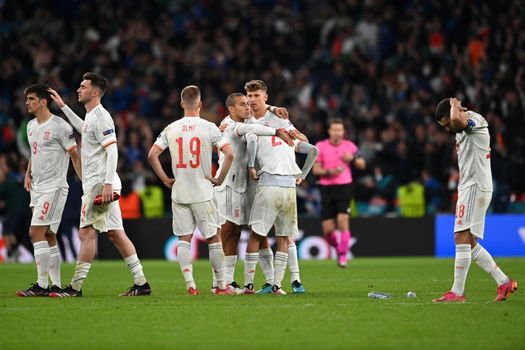 Spain players console each other after losing penalty shootout