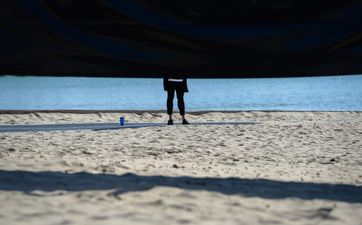 British beach evacuated after ‘large shark’ spotted swimming yards from the shore