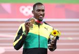 Jamaican gold medalist tracks down volunteer who gave him taxi money to Olympic race