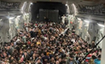 Photos show 640 Afghans crammed into fleeing US Air Force plane