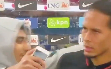 Virgil van Dijk pushes fan who storms him for a selfie during interview