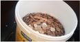 Popular restaurant accused of paying employee with bucket of coins