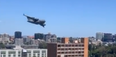 Cargo jet weaves through skyscrapers in Brisbane in tense moment