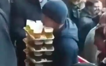 Guy seen carrying 64 pints to mates at football match