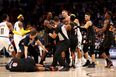 Ugly scenes erupt as 7 foot NBA player bodies opponent from behind