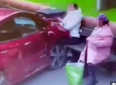 Shocking moment woman smoking on park bench slammed into by car