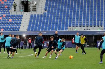 Inter Milan players warm-up for match at Bologna, despite the match being postponed