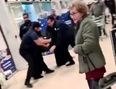 Shocking footage shows mass brawl at Tesco as fearless pensioner casually continues her shopping