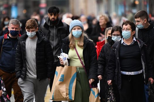 Face masks are no longer mandatory in most settings but some shops will still enforce their use