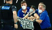 Pro-refugee protestor jumps onto court during Australian Open final