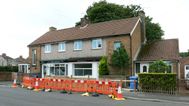 Couple who built 4ft fence to block chippy queues selling home for £105,000 loss