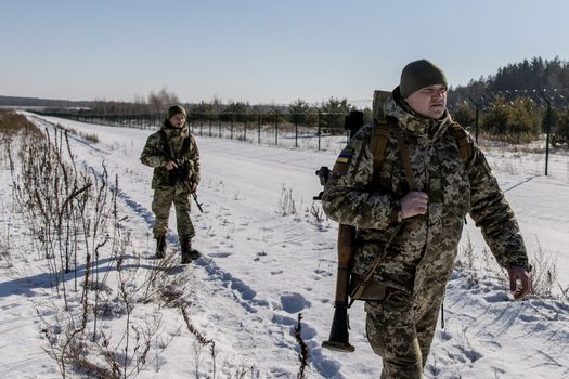 Russia pulls some troops back from Ukraine border