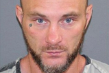 Wanted man ‘snitches on himself’ with vital detail on neck tattoo