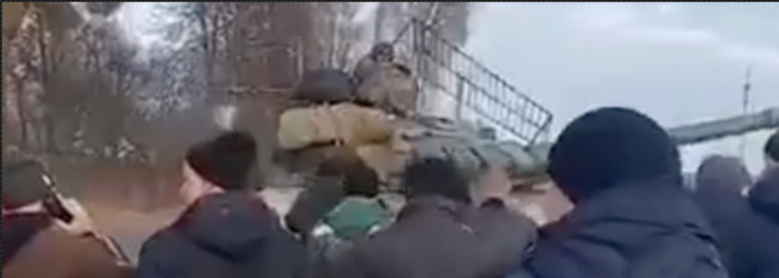 Astonishing video shows hundreds of Ukrainians force Russian tanks to stop by walking at them