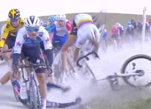 Cyclist sparks huge crash on wet first day of Strade Bianche race