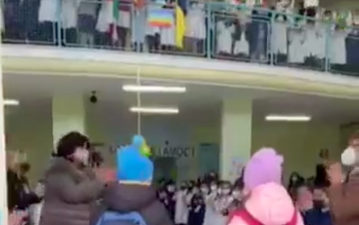 Emotional moment whole school greets nervous Ukrainian refugee children for their first day