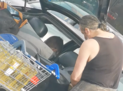 man fills car with cooking oil