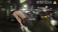 Dramatic moment female cop stops a shirtless thug by pulling his trousers down