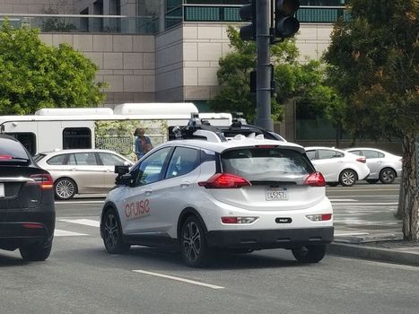 A driverless transport self-driving automobile from General Motor's Cruise division drives through traffic in the Mission Bay neighborhood of San Francisco, California, May 21, 2019. (Photo by Smith Collection/Gado/Getty Images)