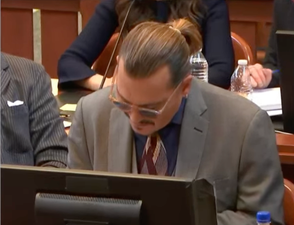 Johnny Depp smirks as court hears audio of Amber Heard call him ‘Junkie Johnny’