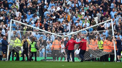 Man City fans break crossbar during pitch invasion