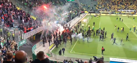 ADO Den Haag fans launch flares at opposition fans after play-off loss
