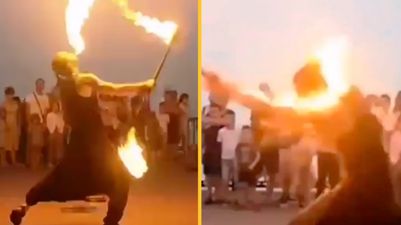Horrific moment fire dancer engulfed by flames after performance goes wrong in front of tourists