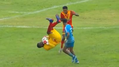 Goalkeeper avoids red card for crazy somersault kick on opponent