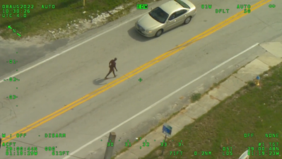 Naked offender armed with a machete tries to rob man of his clothing in incident captured on CCTV