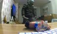 Chilling moment man with knife and balaclava is captured wandering around family’s living room