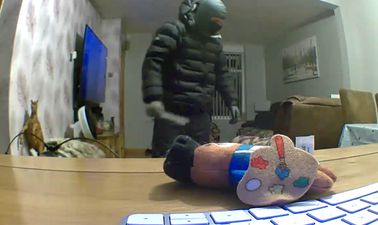Chilling moment man with knife and balaclava is captured wandering around family’s living room