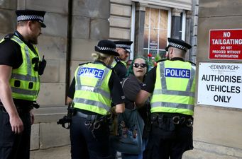 Woman with ‘abolish monarchy’ sign charged with offence after arrests of republican protesters