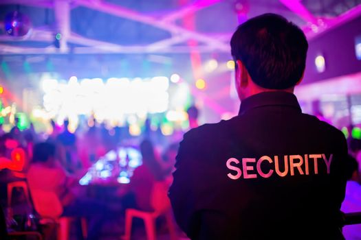 Security guard are regulating the situation of safety in an event concert in a nightclub. stock photo