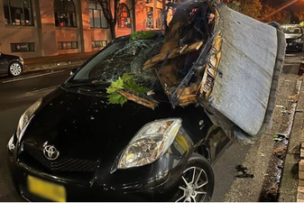 Man returns to his car to find a sofa had fallen from the sky and crushed it