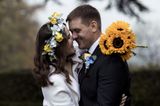 Ukrainian couple marry in the UK surrounded by pictures of their family
