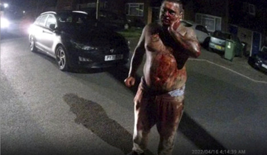 Terrifying pictures show moment victim stabbed in the neck approaches police covered in blood
