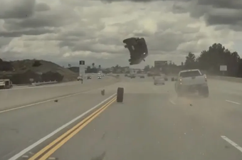 Shocking moment car launched into the air after being hit by stray tyre caught on dashcam