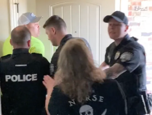Dramatic moment police arrest dad for piercing his son’s ear