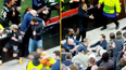 West Ham players clash with hooligans as they dive into the crowd to protect loved ones