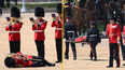 Three troops faint in military parade inspected by Prince William amid record temperatures