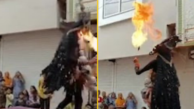 Terrifying moment performer’s face catches fire during fire-breathing stunt