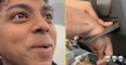 Man gets hand stuck in cup holder on flight after seeing if it would fit