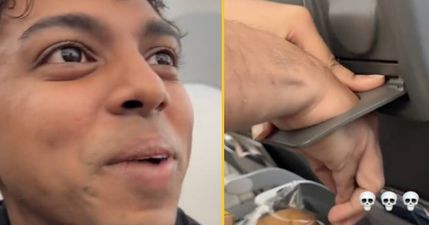 Man gets hand stuck in cup holder on flight after seeing if it would fit