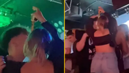 Woman savagely pulls out measuring tape at a club to check if man is tall enough