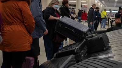 Woman dies after getting stuck in baggage carousel at major airport